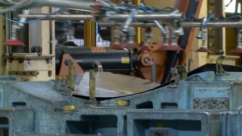 Robots move metal plates to molding machine inside Khodro car factory, Iran Stock Footage 119159100