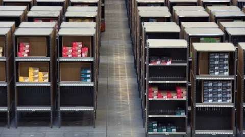 Robots moving shelves in a storage capacity Stock Footage 99052414