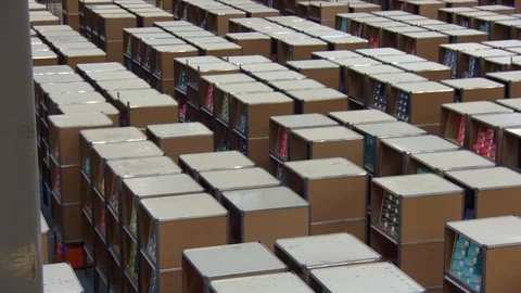 Robots moving shelves in a storage capacity Stock Footage 99052475