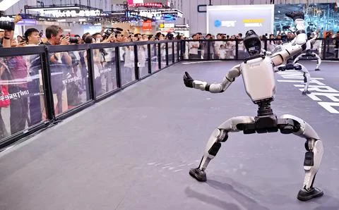 Robots Perform on Stage at 2026 World Robot Conference in Beijing Stock Photos