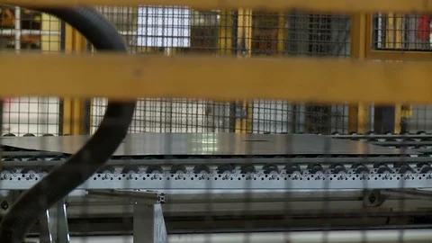 Robots pick metal plates to be molded inside Khodro car factory, Iran Stock Footage 119157934