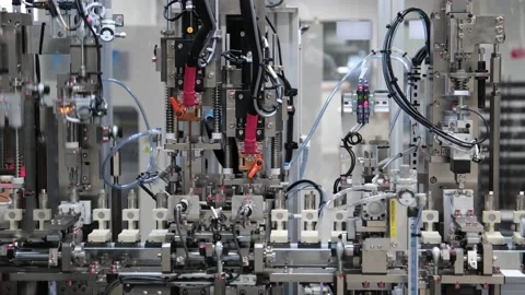 Robots Pressing Down in Production Line in an Industrial Automation Facility 8K Stock Footage 220337469