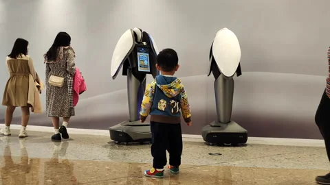 Robots providing information services  at a shopping mall in Shanghai Stock Footage 164317898