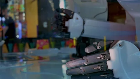 Robots serve visitors. Robotic arms with functions similar to the human arm are Stockbeeldmateriaal 157239686