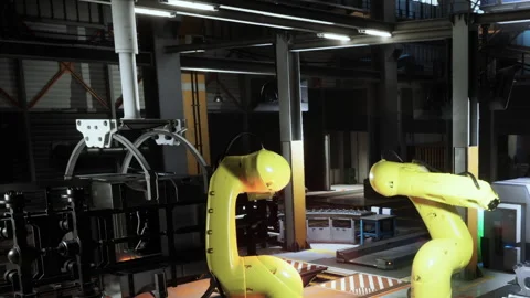 Robots working in a factory setting during daytime Stock Footage 344410266