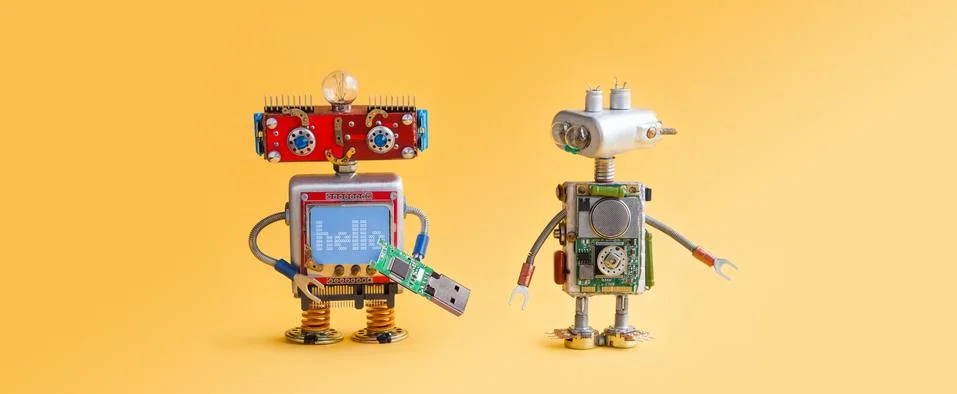Robots on yellow background. 4th industrial revolution automation concept Stock Photos