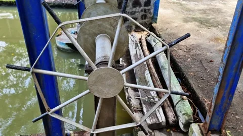 Robust Steel Handwheel Controls River Sluice Gate Industrial Closeup Video stock 332415645