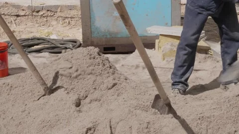 Robusts throw sand on the construction site Stock Footage 132494214