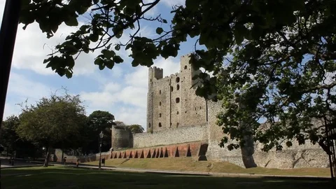 Rochester Castle panning with tree branches in foreground Stock Footage 70143218