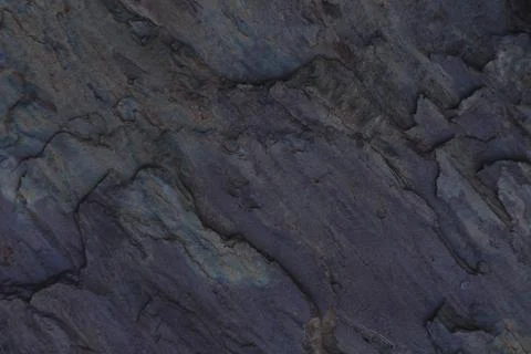 Rock abstract dark stone pattern. Minerals. Geology. Stone texture. Stock Photos