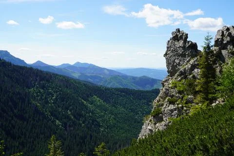 Rock against the backdrop of mountains Stock Photos