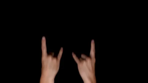 Rock and roll devil handsigns on a black chroma key background, medium Stock Footage 117475669