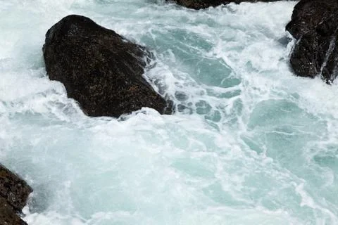 Rock and wave Stock Photos