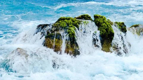 Rock and wave Stock Photos