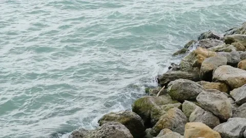 Rock and waves on shore or coast of the sea Stock Footage 229929853