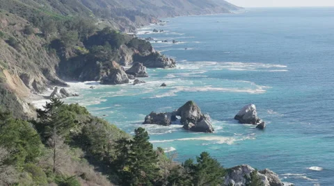 Rock arch and waves along Big Sur Coast Stock Footage 57925901