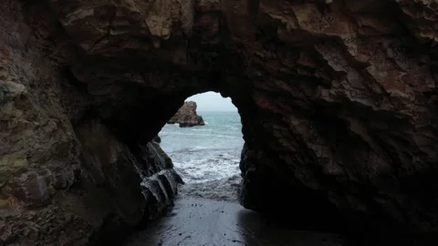 Rock Arch Fly Through Rugged Pacific Coast Davenport California Drone Video Stock Footage 142779529