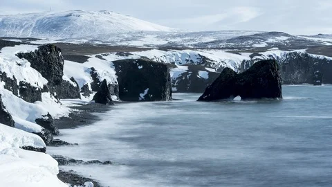 Rock arch in waves Stock Footage 86302425