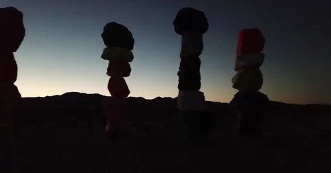 Rock Art Silhouette with sunset in background Stock Footage