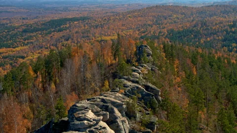 A rock with an autumn forest on the slopes Stock Footage 173341121