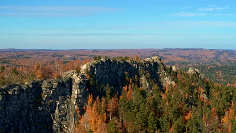 A rock with an autumn forest on the slopes Stock Footage 173355009