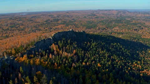 A rock with an autumn forest on the slopes Stock Footage 173573246