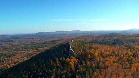 A rock with an autumn forest on the slopes Stock Footage 173591123