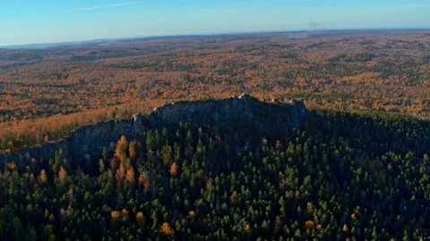 A rock with an autumn forest on the slopes Stock Footage 180591957