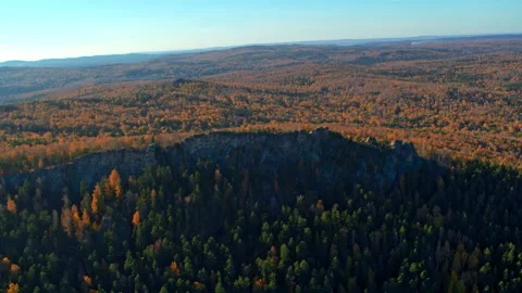 A rock with an autumn forest on the slopes Stock Footage 180624732