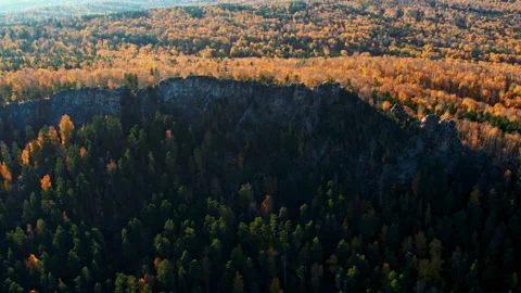 A rock with an autumn forest on the slopes Stock Footage 180674871