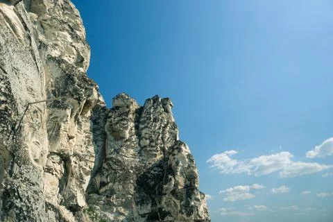 Rock on the background of fields Stock Photos