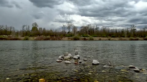 Rock balance on lake Stock Footage 228716892