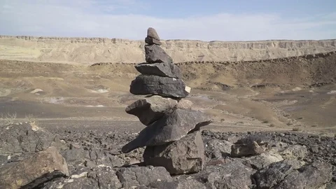 Rock balancing in Makhtesh Ramon Crater in Israel Stock Footage 77256161