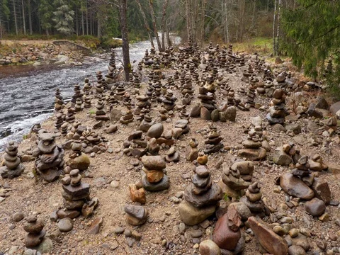 Rock balancing at the river Stock Footage 82872039