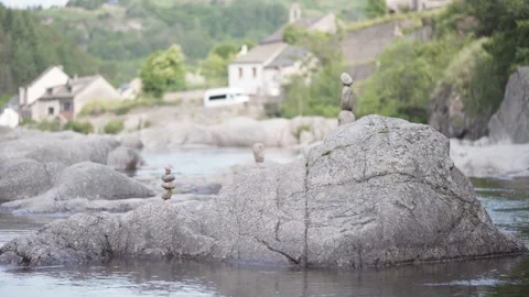 Rock Balancing - Stacked Rock On Boulder In The River. - static shot Stock Footage 294908676