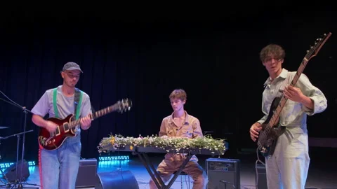 Rock band performs on stage Stock Footage 161814296