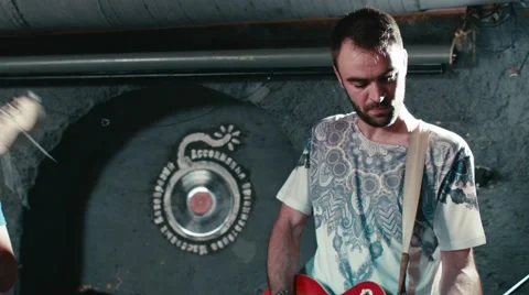 Rock band performs in underground pub Stock Footage 64997202