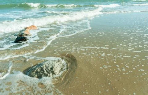 Rock on the beach with softwave Stock Photos