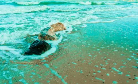 Rock on the beach with softwave Stock Photos