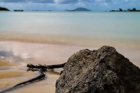 Rock on beautiful Sandy beach Stock Photos