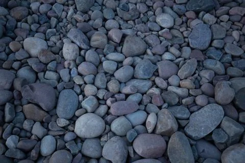 Rock bed pebbles pattern on beach Stock Photos