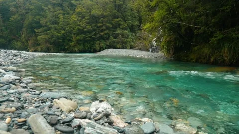 Rock beneath crystal clear river 動画素材 260850412