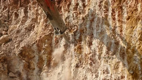 Rock breaking machine working on construction site Vídeo Stock 232227295