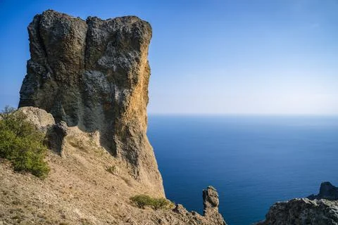 Rock called Devil's finger in the Karadag nature reserve against the blue sky Stock Photos