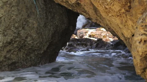 Rock cave with ocean wave Stock Footage 998074