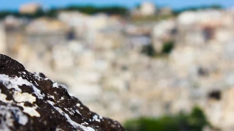 Rock with city in the background Stock Footage 94226417