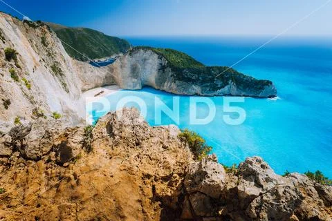 Rock Cliffs in front of Navagio beach Zakynthos. Shipwreck bay with turquoise Stock Photos