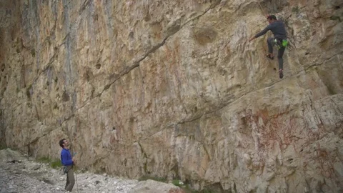 Rock Climber in the Alps falls down Stock Footage 114764587