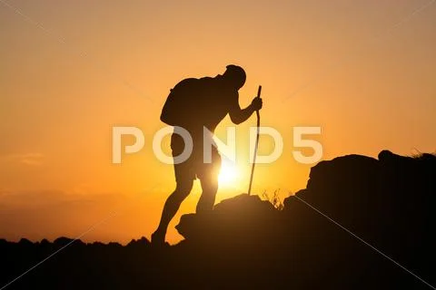 Rock climber ascending the mountain Stock Photos