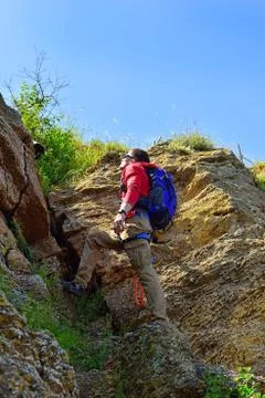 Rock-climber with backpack Stock Photos